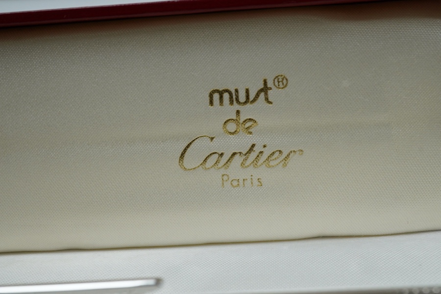 A Cartier pen, 14cm long, boxed. Condition - good